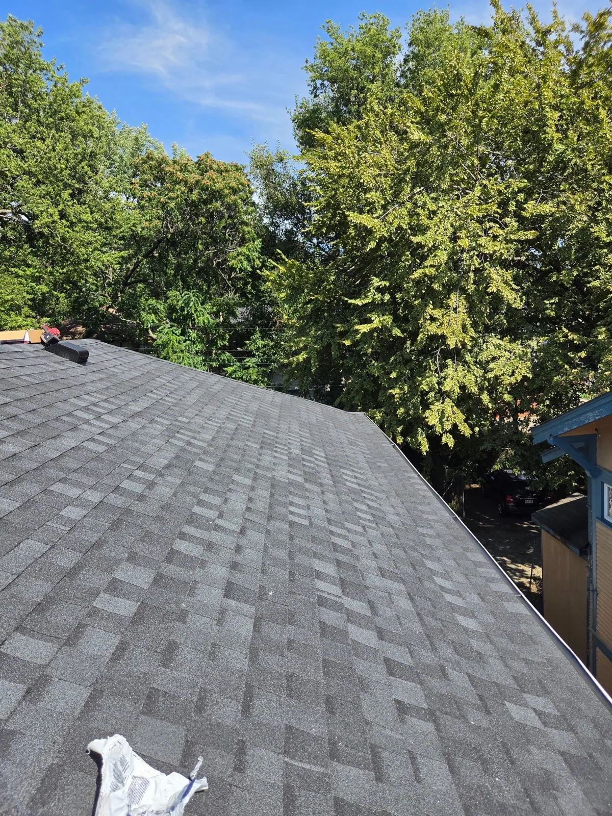 Completed shingle roof at a recent Ledger Roofing residential project